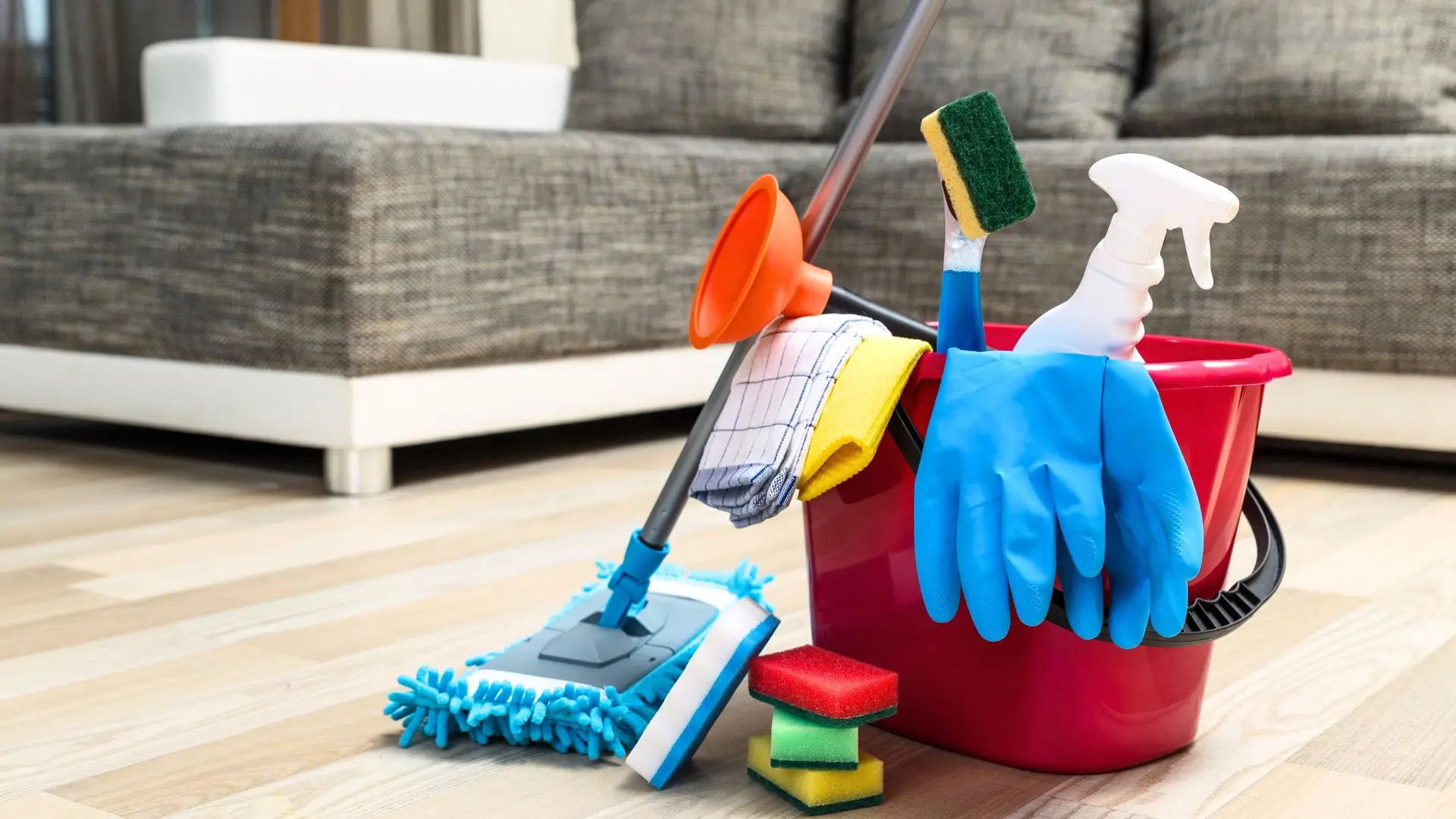 A bucket filled with professional cleaning tools, representing expert home and business cleanout services in Tampa Bay.